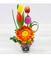 Glass container with Tulips and Gerbera